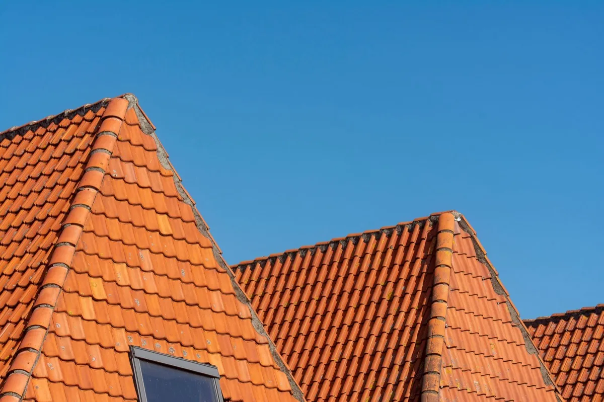 Clay barrel tile rooflines on homes in Fishers, IN