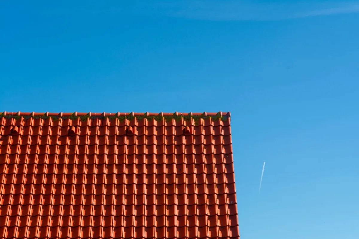 Tile roof gable in full sun, the kind of exposure that sets roof life in Fishers, IN